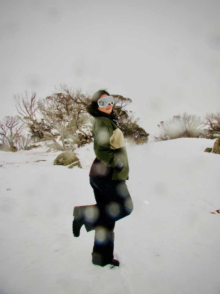 Sonika mid-pose in the snow